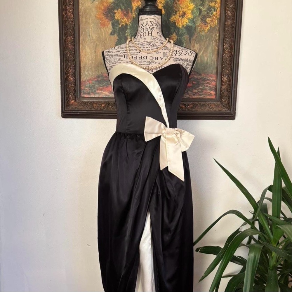 Elegant Black Satin Strapless Formal Gown with Cream Bow from Gunne Sax